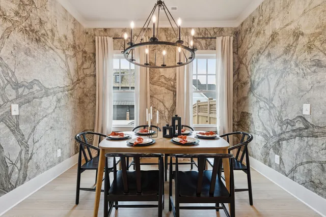 a view of a dining room with furniture and table