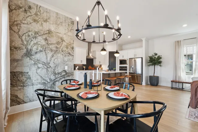 a kitchen with stainless steel appliances kitchen island granite countertop a sink and cabinets