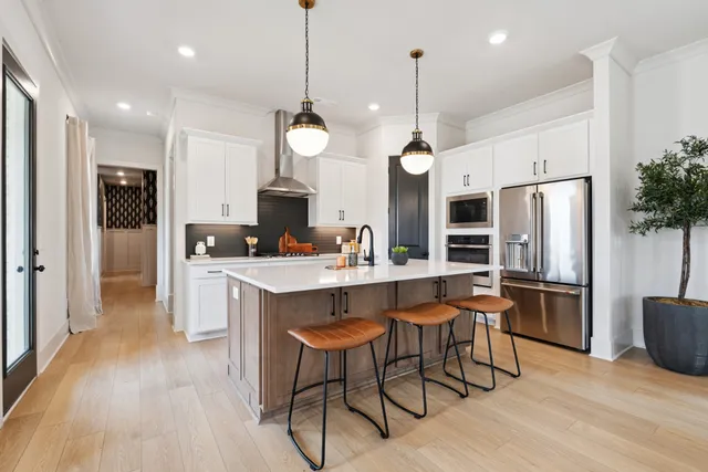 a kitchen with granite countertop cabinets and a stove