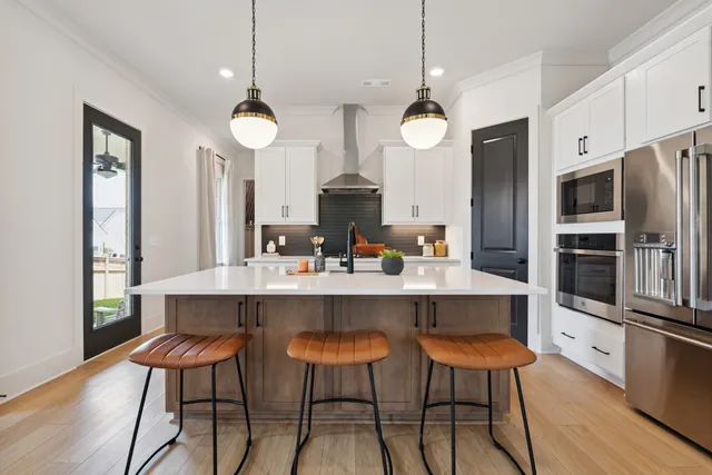 a kitchen with a sink cabinets and appliances