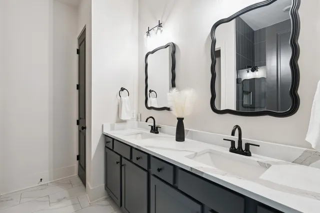 a bathroom with a sink a toilet a mirror and vanity