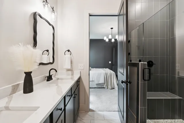 an empty room with closet and a chandelier fan