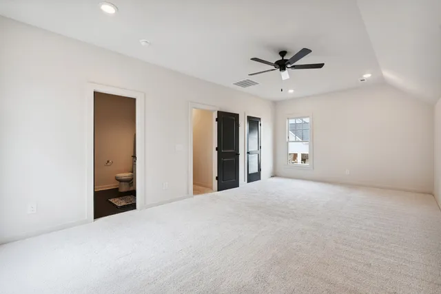 a view of a patio with a table and chairs and potted plants