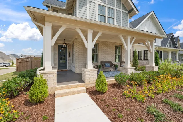 a view of a patio with table and chairs and potted plants