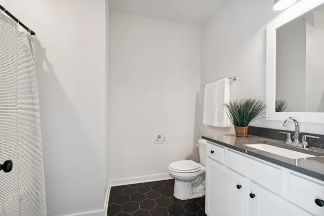 a picture of a bathroom with a shower