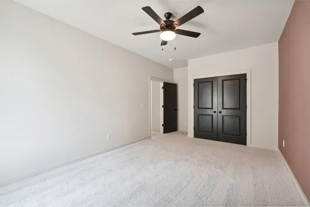 a view of a swimming pool with lawn chairs and a big yard