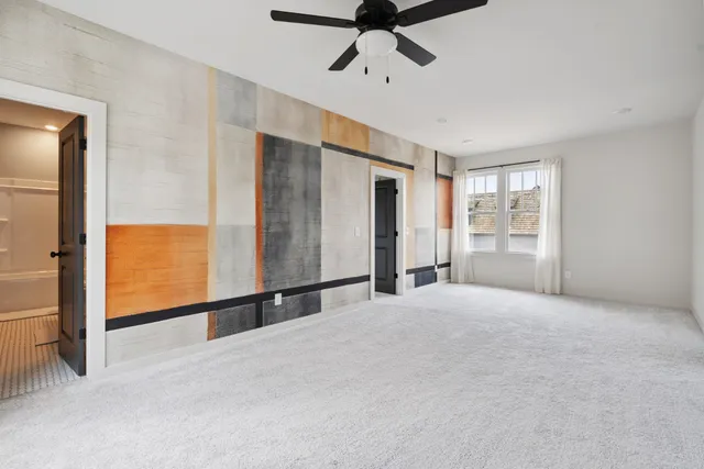 a living room with furniture chandelier and a large window