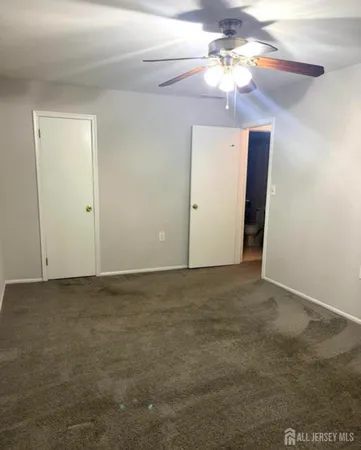 a view of a chandelier fan in a room