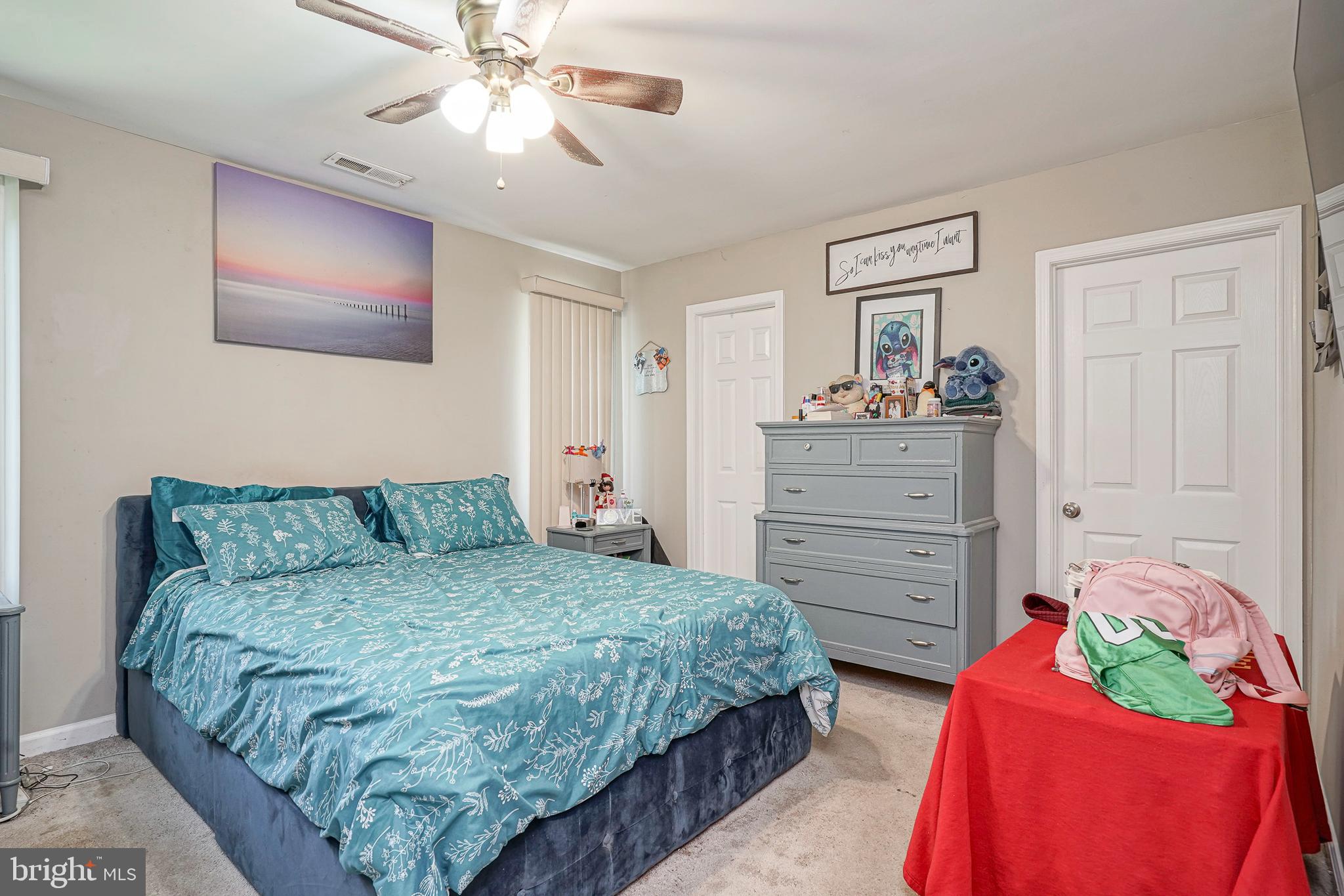 308 B Collins Lane Maple Shade, NJ 08052 - Photo 12 of 26 a bedroom with a bed and a chandelier
