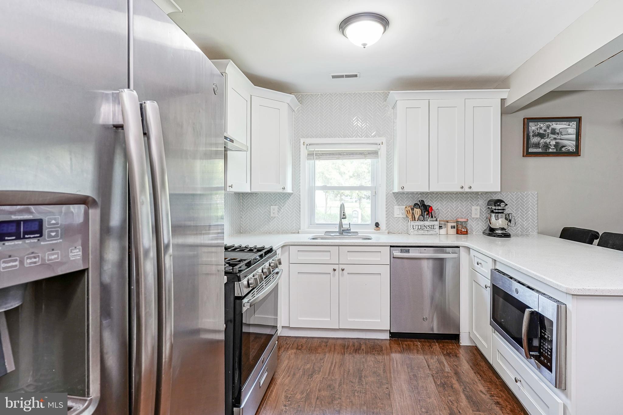 308 B Collins Lane Maple Shade, NJ 08052 - Photo 9 of 26 a kitchen with a sink stove and refrigerator