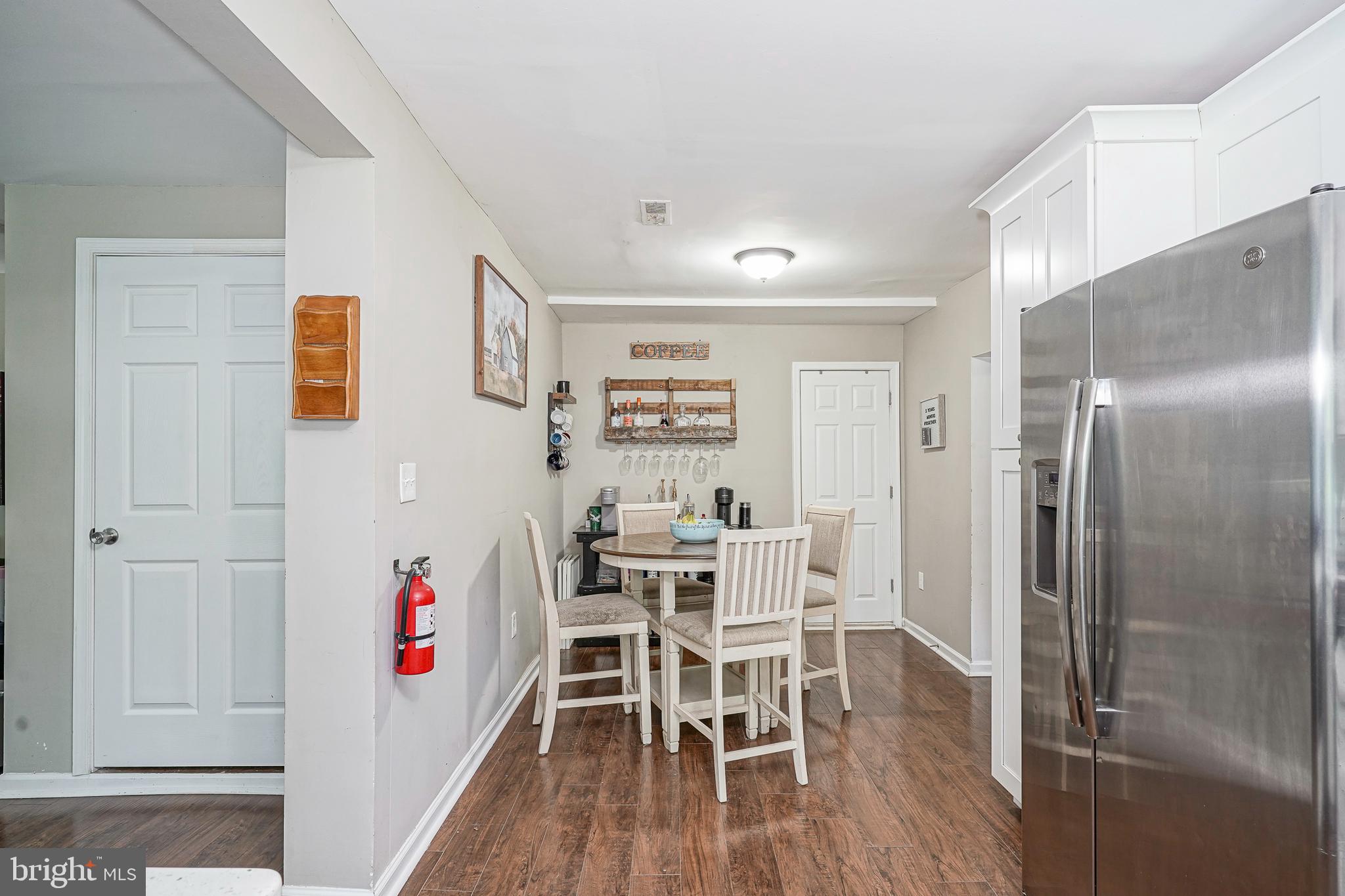 308 B Collins Lane Maple Shade, NJ 08052 - Photo 10 of 26 a view of a kitchen with fridge and wooden floor