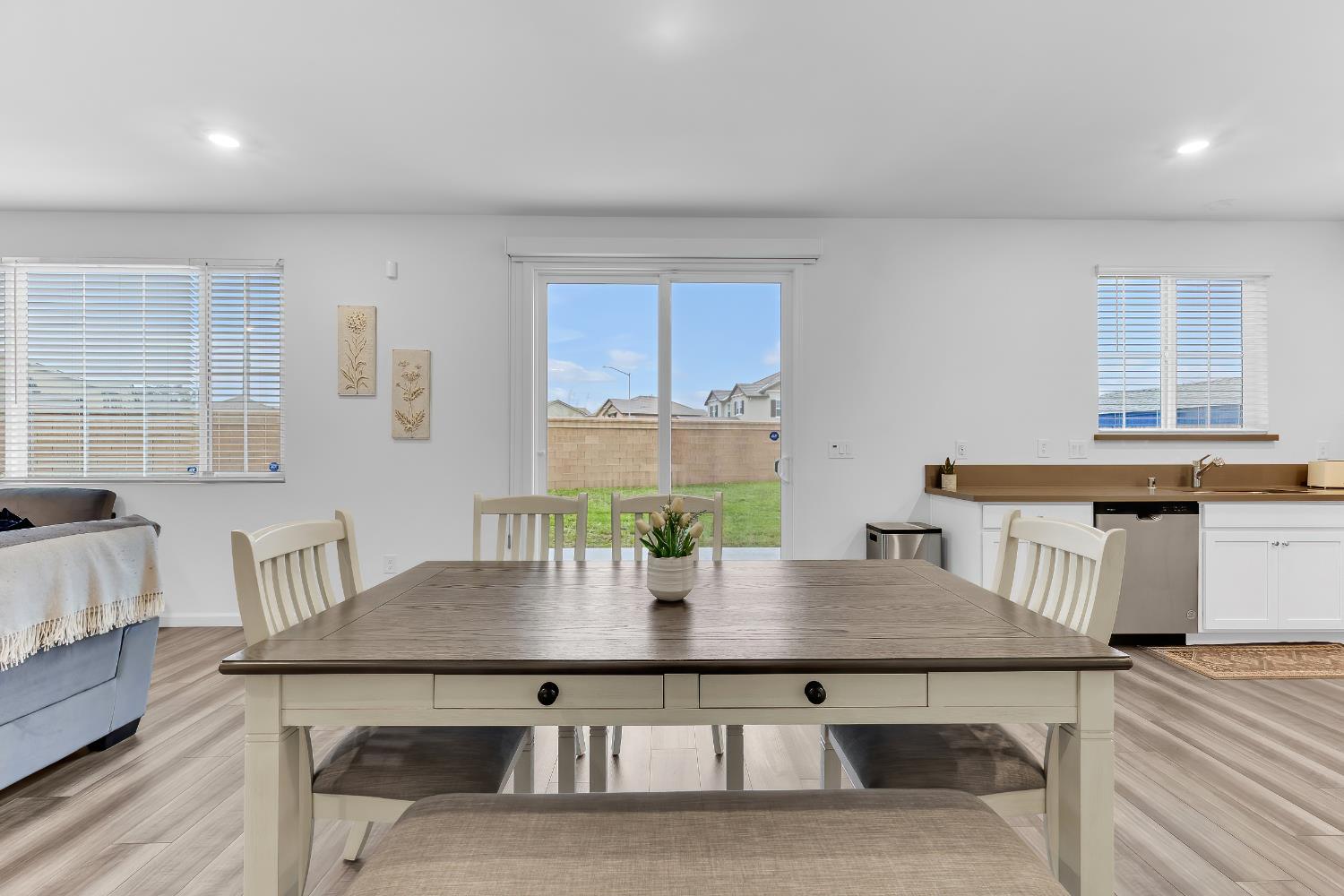 3600 Pride Way Stockton, CA 95212 - Photo 18 of 50 a view of a dining room with furniture and wooden floor