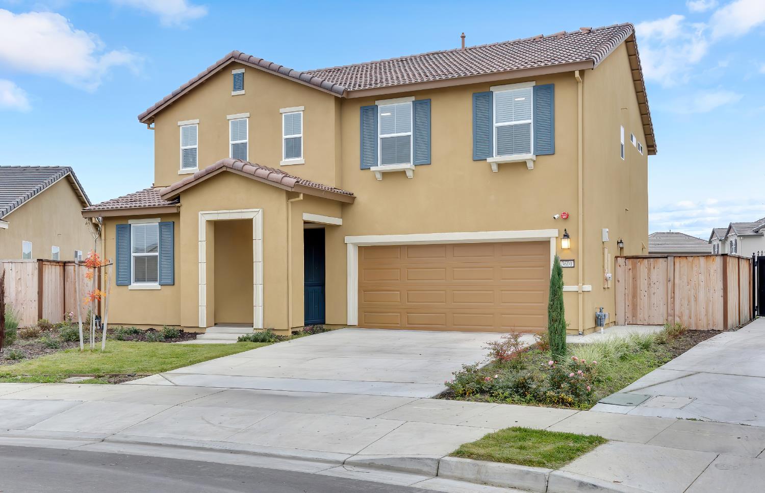 3600 Pride Way Stockton, CA 95212 - Photo 2 of 50 a front view of a house with a yard and garage