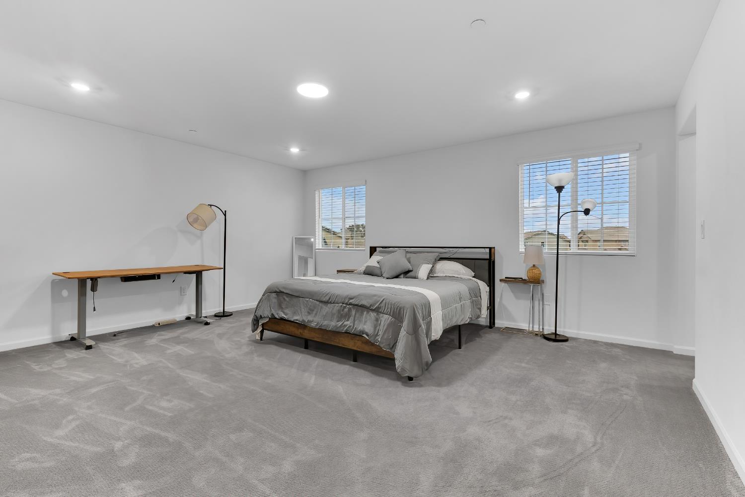 3600 Pride Way Stockton, CA 95212 - Photo 23 of 50 a bedroom with a bed and a table