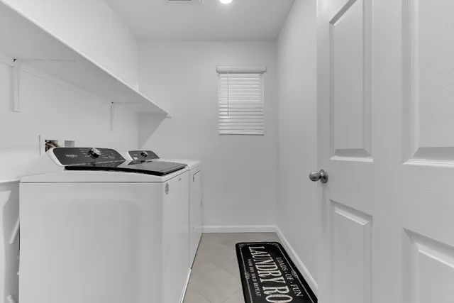 a view of kitchen with sink and washing machine