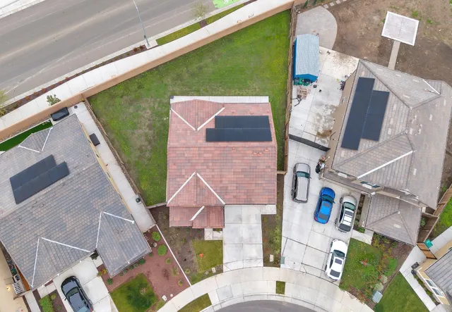 an aerial view of a house with a garden