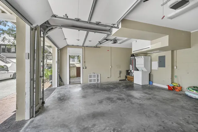 a view of a porch with chairs and potted plants