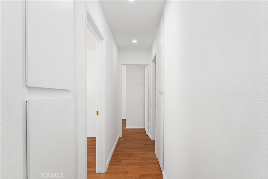 1381 South Walnut Street, Unit 2101 Anaheim, CA 92802 - Photo 14 of 29 Upstairs hallway with two storage closets