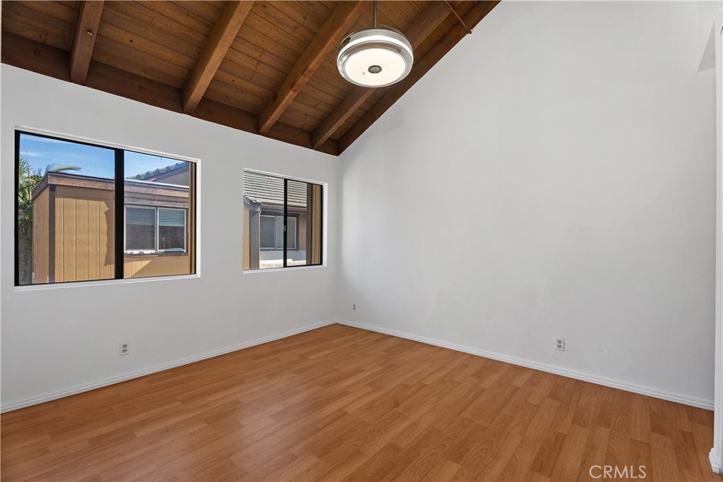 1381 South Walnut Street, Unit 2101 Anaheim, CA 92802 - Photo 20 of 29 Primary bedroom with vaulted ceilings and ensuite bathroom