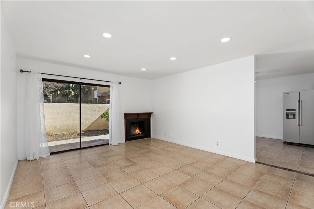 1381 South Walnut Street, Unit 2101 Anaheim, CA 92802 - Photo 4 of 29 Living room with recessed lighting and fireplace
