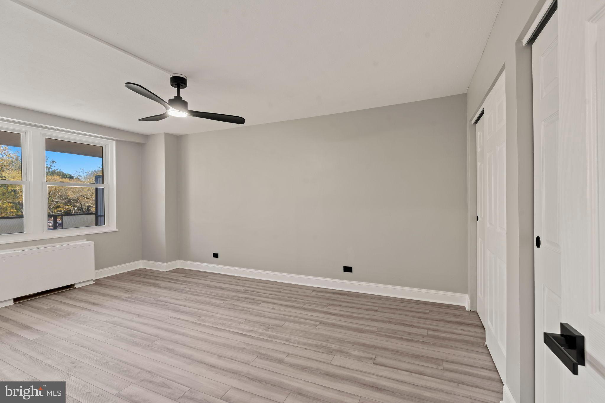 1600 Hagys Ford Road, Unit 3Y Narberth, PA 19072 - Photo 14 of 38 a view of room with window ceiling fan and hardwood floor