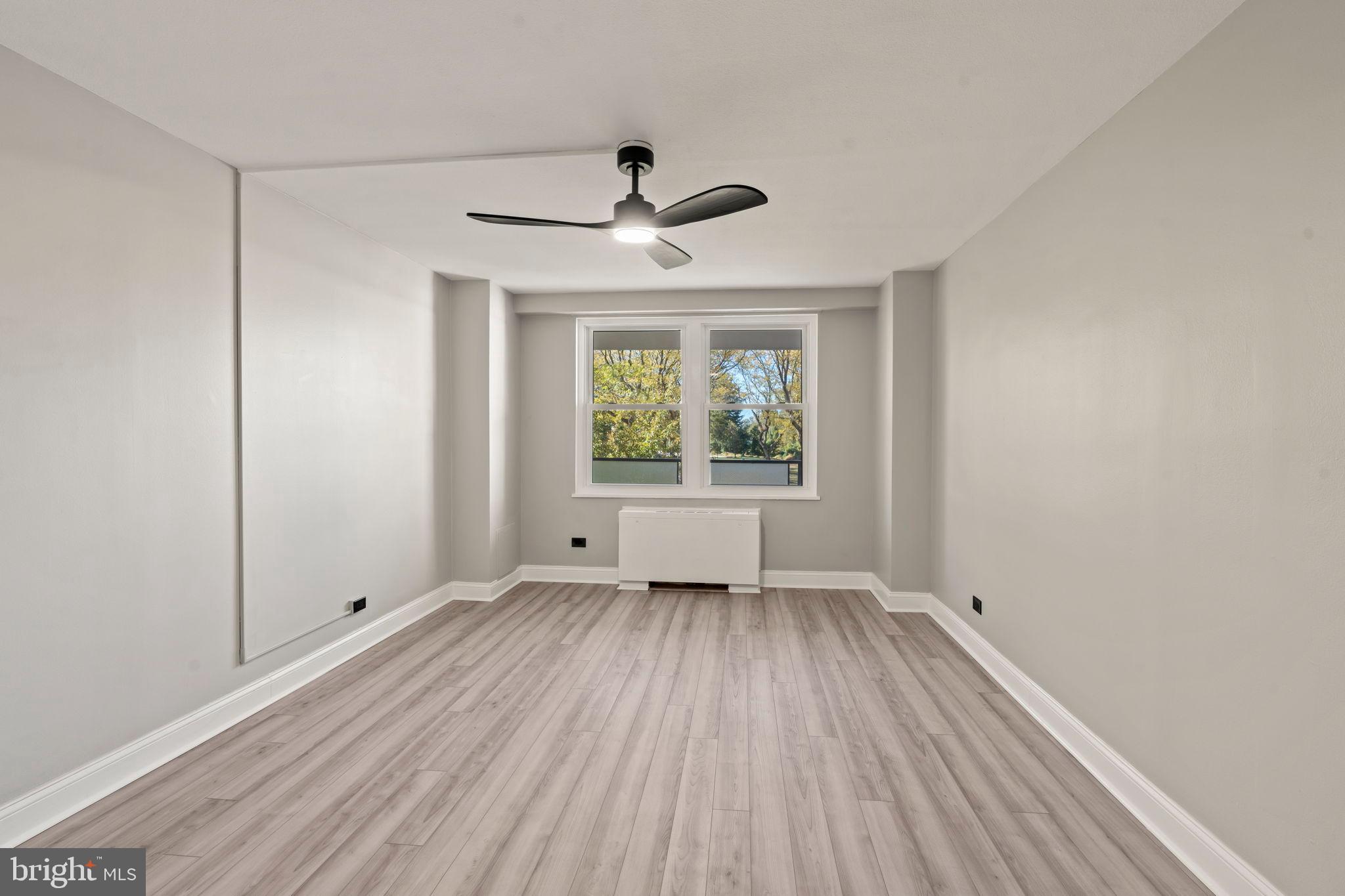 1600 Hagys Ford Road, Unit 3Y Narberth, PA 19072 - Photo 15 of 38 wooden floor in an empty room with a window