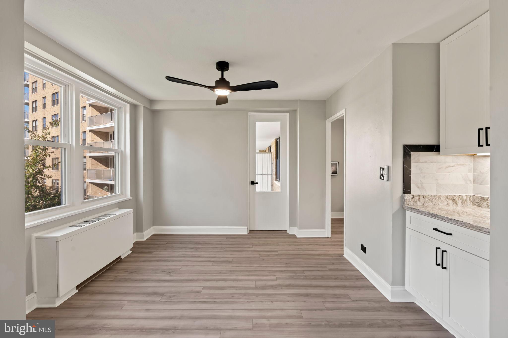 1600 Hagys Ford Road, Unit 3Y Narberth, PA 19072 - Photo 2 of 38 a view of a hallway with wooden floor and cabinet