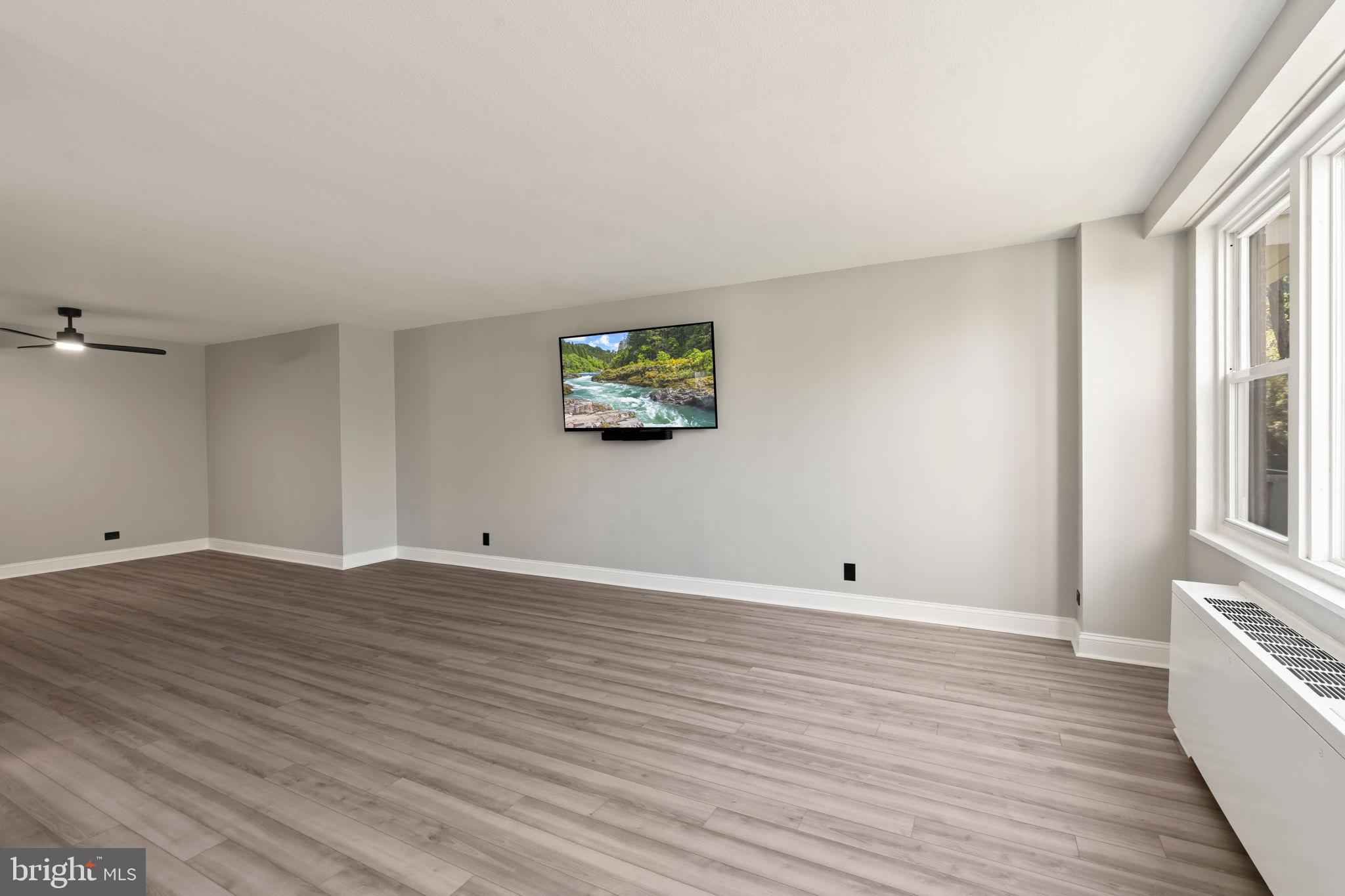 1600 Hagys Ford Road, Unit 3Y Narberth, PA 19072 - Photo 8 of 38 a view of room with wooden floor and window