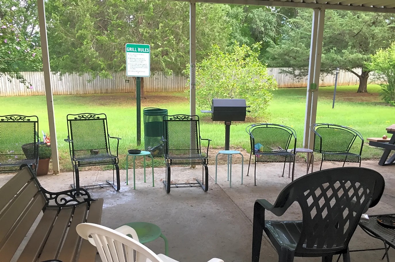 122 Kickapoo Street Palestine, TX 75803 - Photo 5 of 6 a view of a patio with a table chairs and a backyard