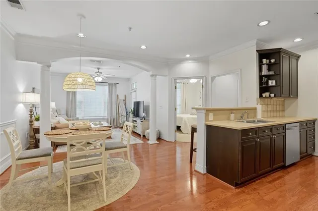 a large kitchen with a large counter top appliances and cabinets