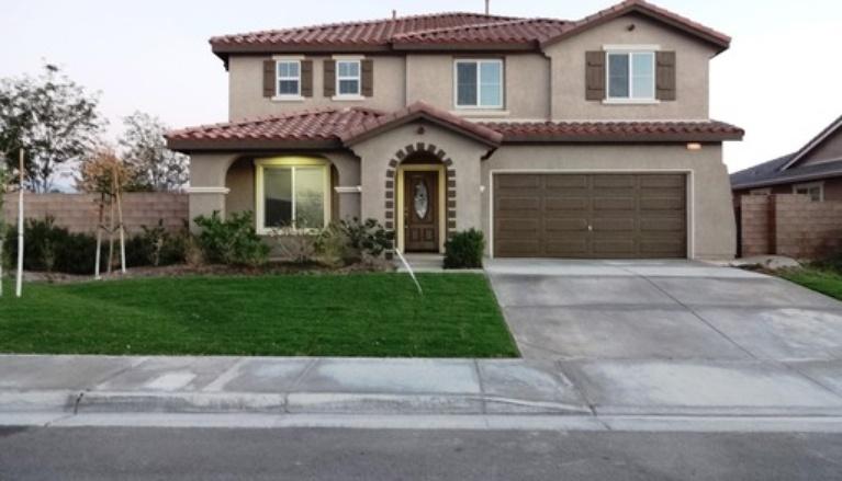 6332 Explorer Way Palmdale, CA 93552 - Photo 1 of 8 a front view of a house with a garden and plants