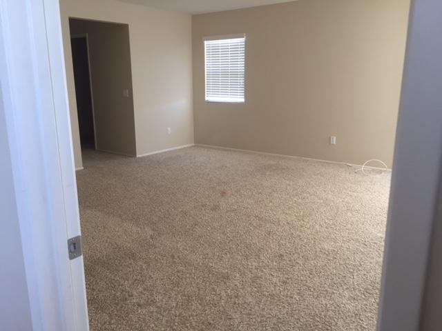 6332 Explorer Way Palmdale, CA 93552 - Photo 4 of 8 an empty room with windows