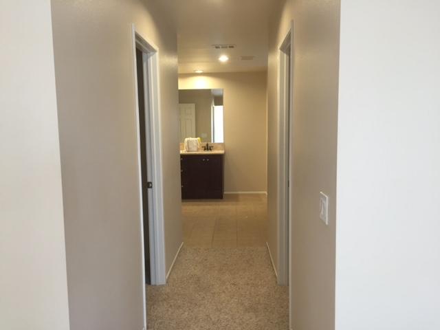 6332 Explorer Way Palmdale, CA 93552 - Photo 7 of 8 a view of hallway with bathroom