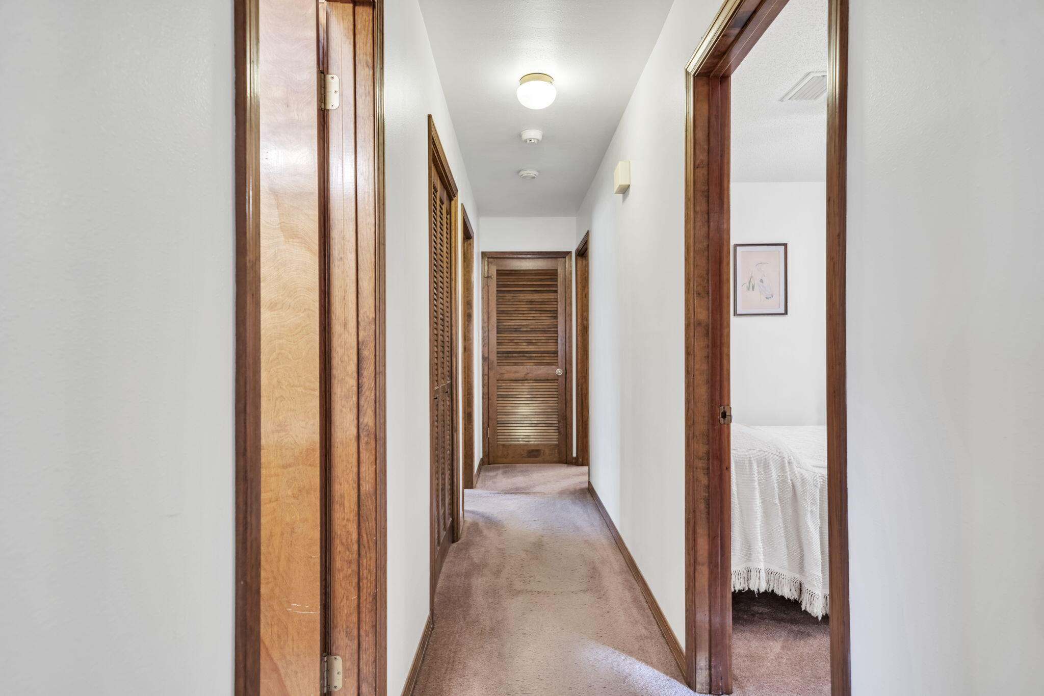 392 Evergreen Circle Destin, FL 32541 - Photo 12 of 32 a view of a hallway with wooden floor