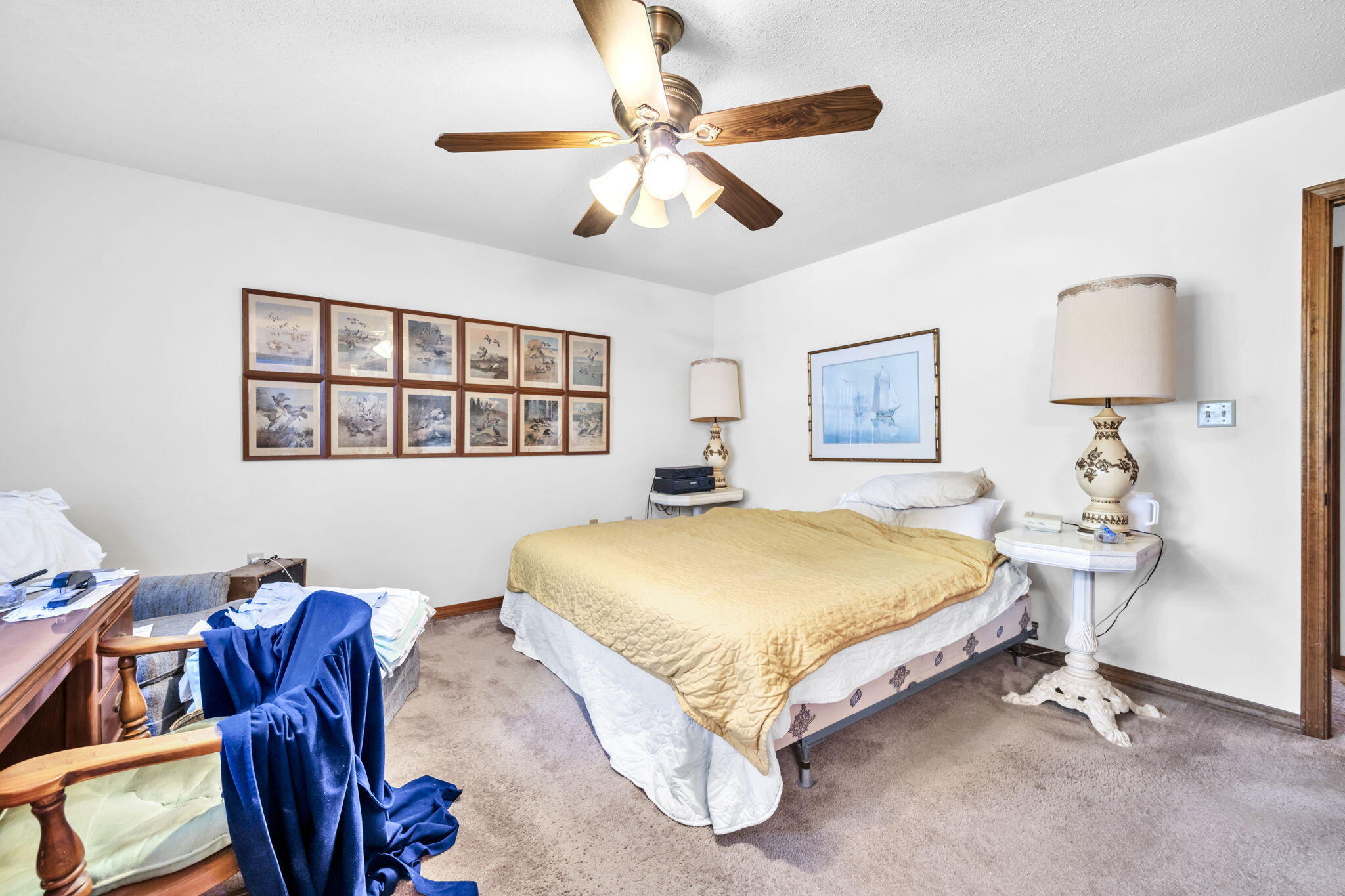 392 Evergreen Circle Destin, FL 32541 - Photo 13 of 32 a spacious bedroom with a bed and a chandelier