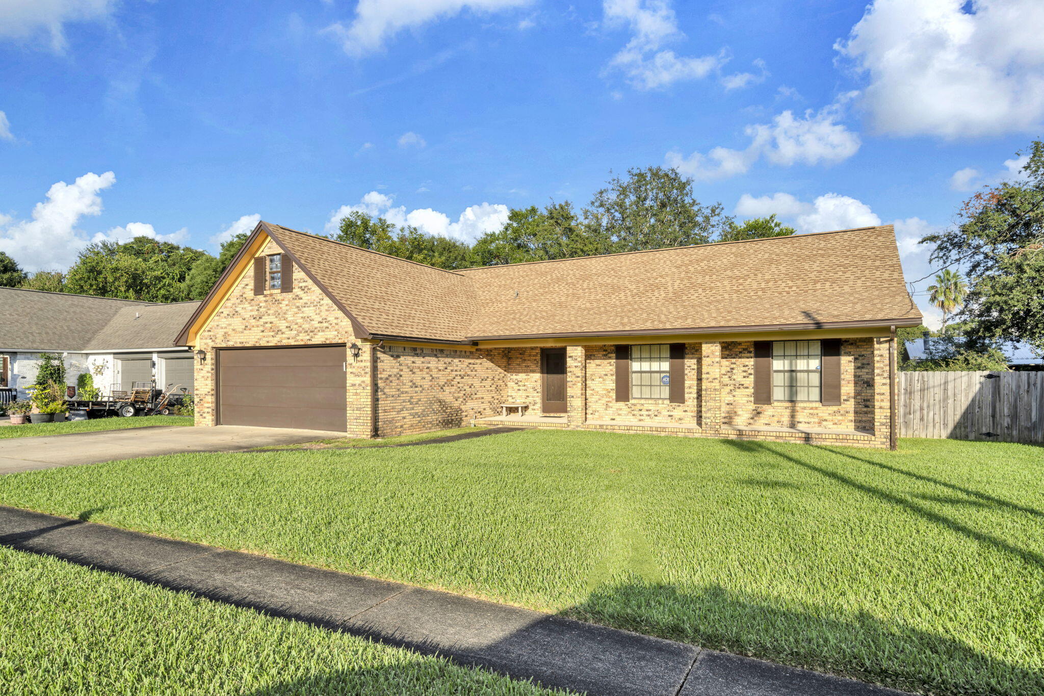 392 Evergreen Circle Destin, FL 32541 - Photo 2 of 32 a front view of a house with a yard
