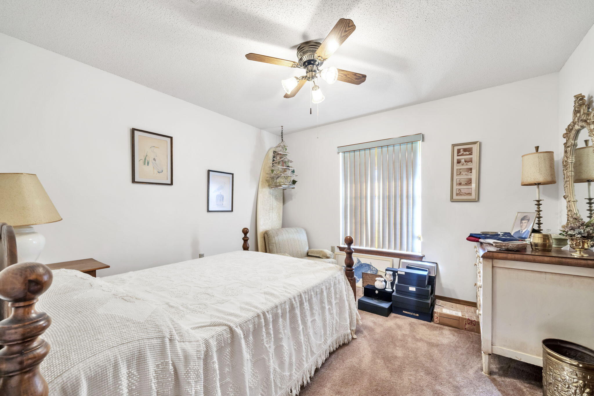 392 Evergreen Circle Destin, FL 32541 - Photo 22 of 32 a bedroom with a bed and a chandelier