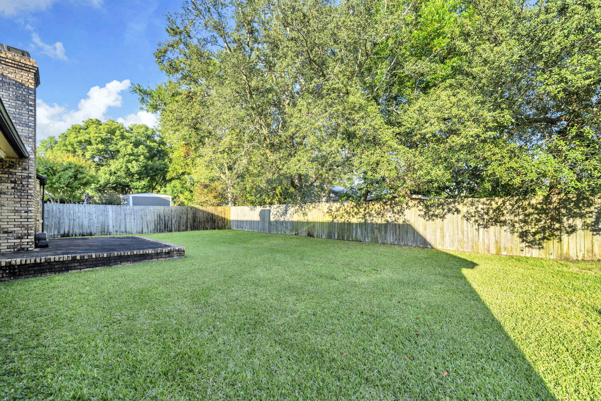 392 Evergreen Circle Destin, FL 32541 - Photo 28 of 32 a view of a backyard with large trees