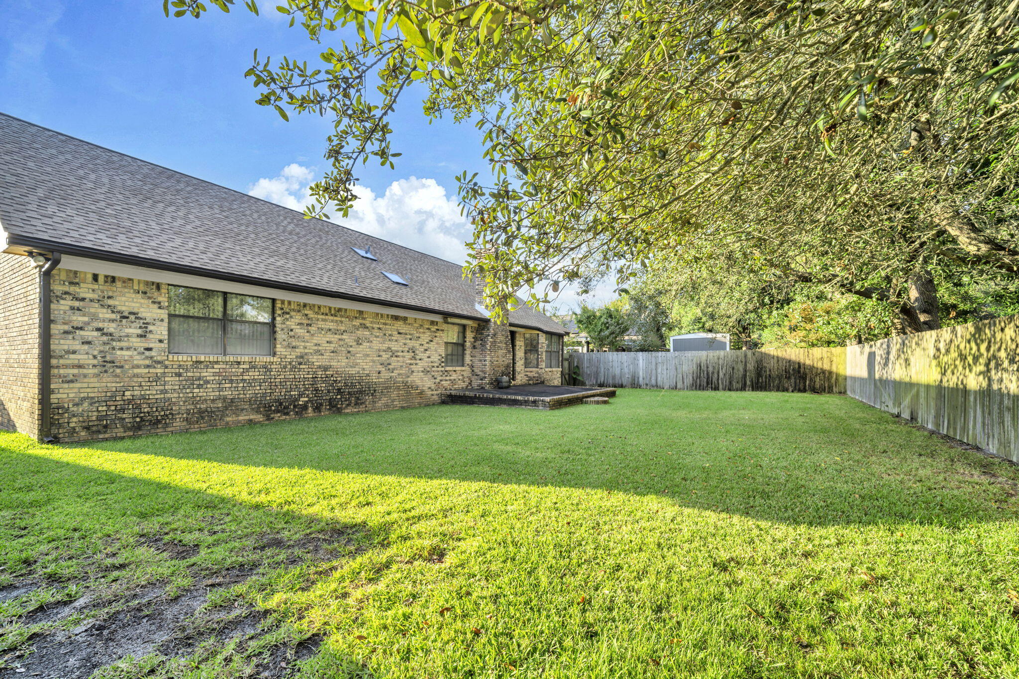 392 Evergreen Circle Destin, FL 32541 - Photo 29 of 32 a view of a backyard with plants and large trees