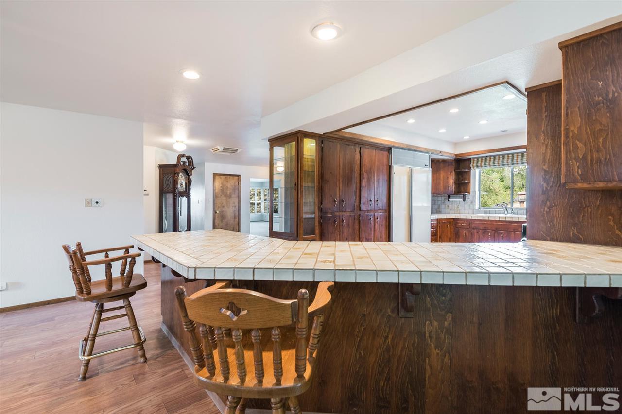 2255 Armstrong Lane Reno, NV 89509 - Photo 8 of 21 a view of a dining room with furniture and wooden floor