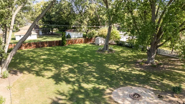 a backyard of a house with lots of green space