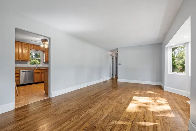 a view of a hallway with a kitchen