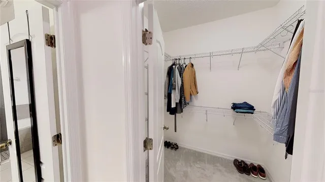 a bathroom with a granite countertop sink a shower and a mirror