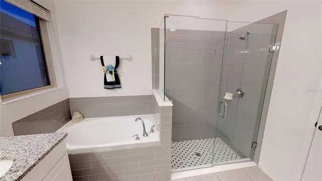 a bedroom with furniture and a wooden floor