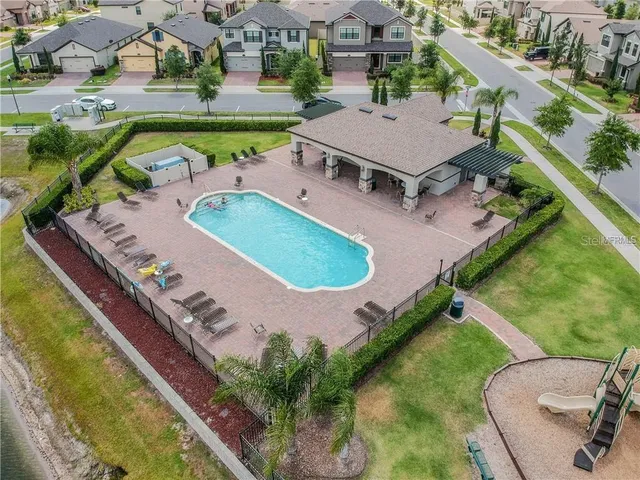 an aerial view of a house with a swimming pool