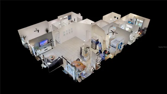 a bed sitting in a bedroom next to a lamp