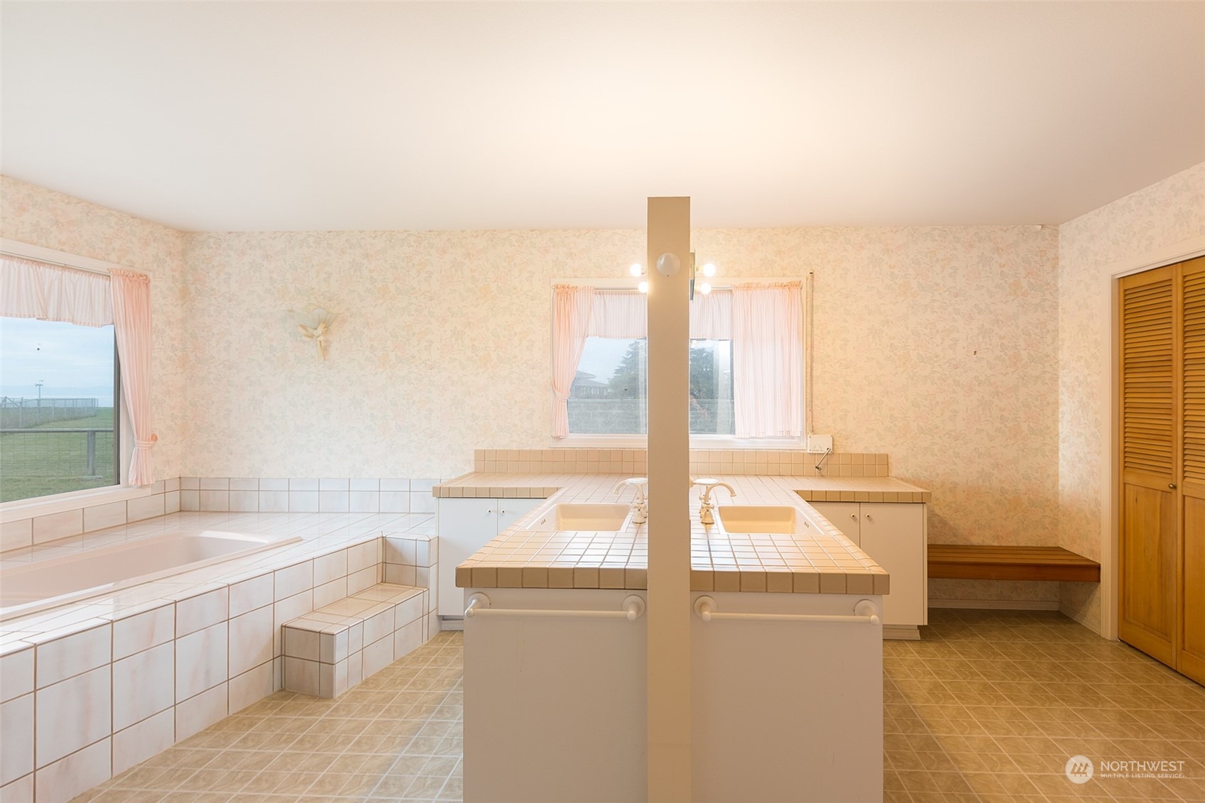 193 Mariners Point Road Sequim, WA 98382 - Photo 14 of 36 a room with a bed and a large window