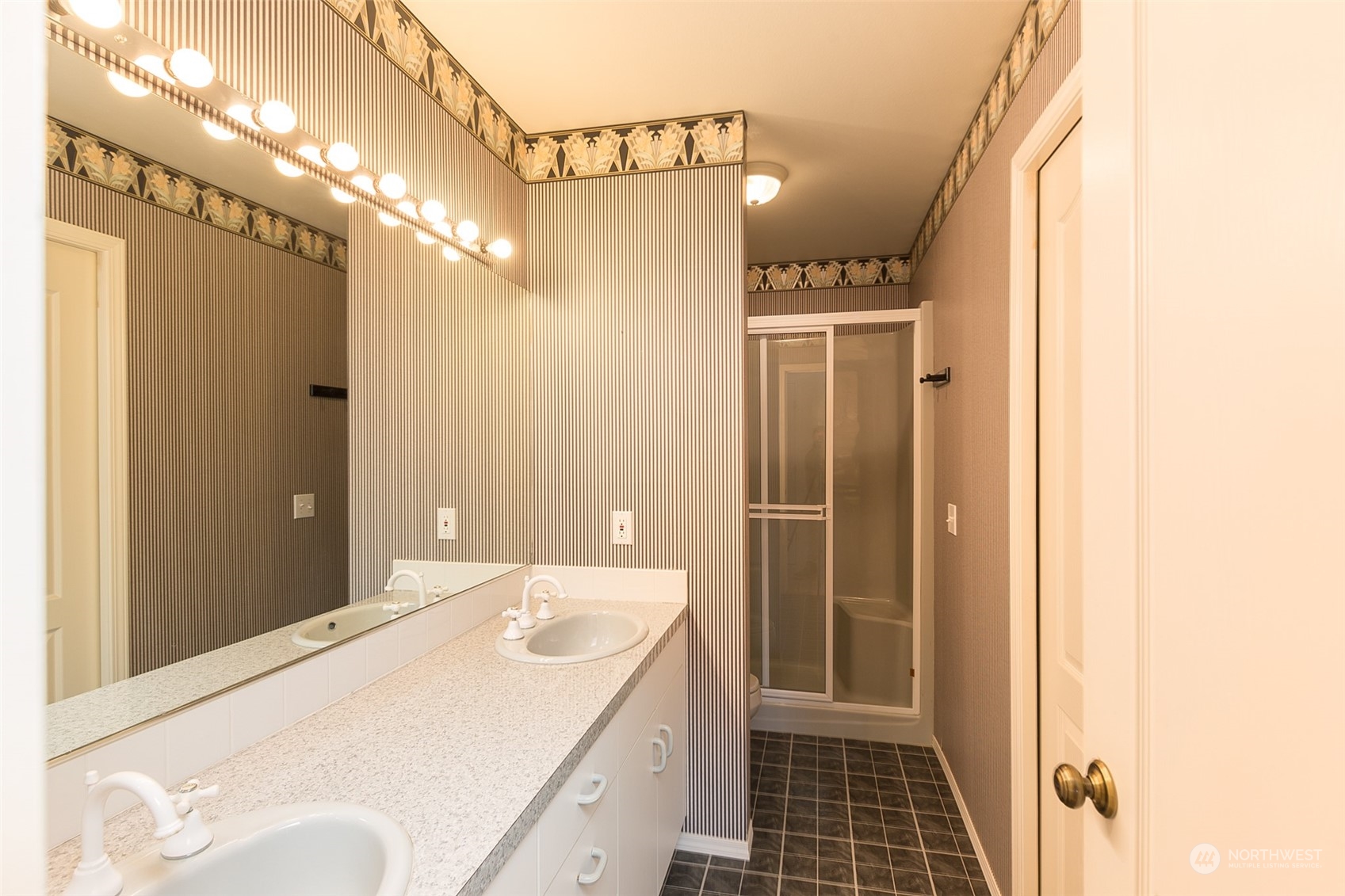 193 Mariners Point Road Sequim, WA 98382 - Photo 17 of 36 a bathroom with a sink a toilet and shower