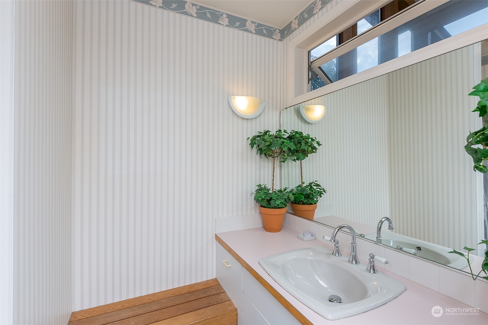 193 Mariners Point Road Sequim, WA 98382 - Photo 19 of 36 a bathroom with a sink and a mirror
