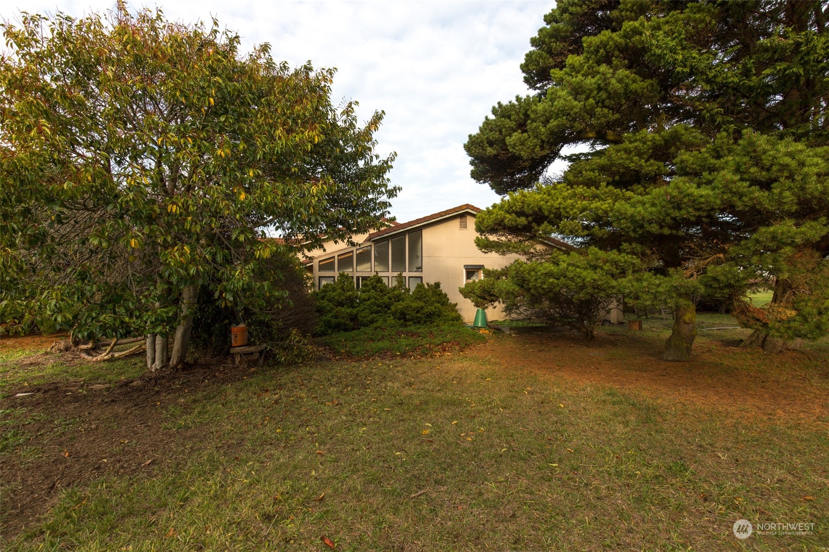 193 Mariners Point Road Sequim, WA 98382 - Photo 26 of 36 a view of a house with a tree